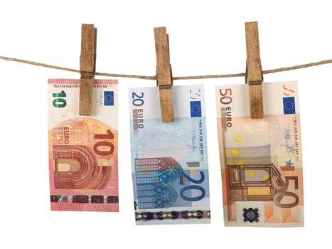 euro banknotes drying on clothesline