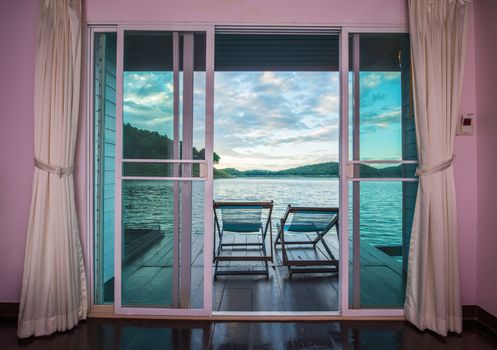 Door with views a tropical lake scene. (Srinakarin Dam, Kanchanaburi Province, Thailand)