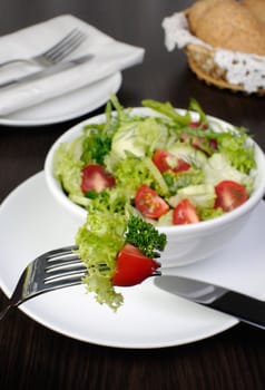 Light summer salad of lettuce with arugula and cherry tomatoes