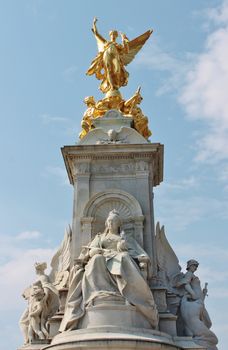 The Victoria Memorial is a sculpture dedicated to Queen Victoria, sculpted by Sir Thomas Brock in London, placed at the centre of Queen's Gardens in front of Buckingham Palace.