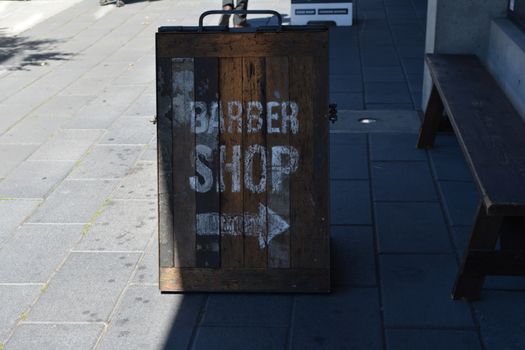 old wooden barber shop sign