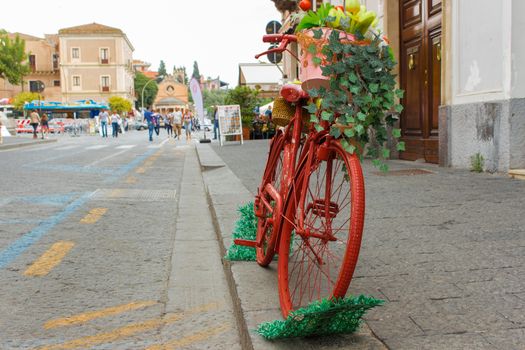 Antique red bike on the way