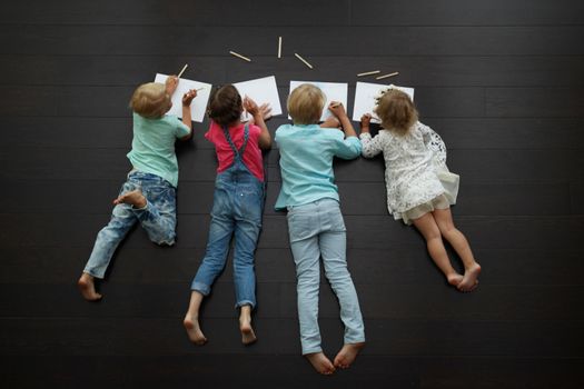 kids drawing pictures at home