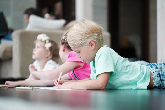 kids drawing pictures at home