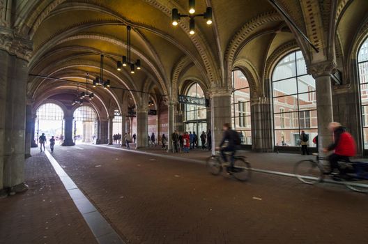 Amsterdam, Netherlands - May 6, 2015: People at main entrance of the Rijksmuseum passage on May 6, 2015. Rijksmuseum is a Netherlands national museum dedicated to arts and history in Amsterdam.