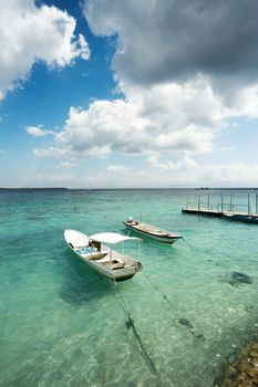 romantic Small boats on nusa penida beach, Bali Indonesia with blue sky, tranquil scene