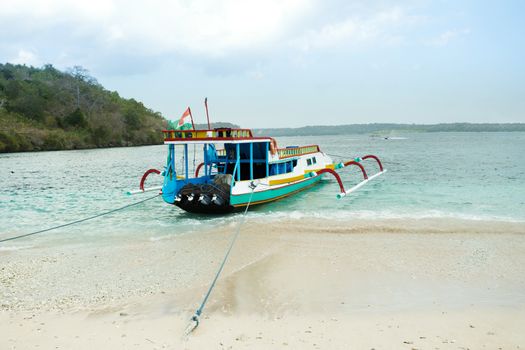 Catamaran on sandy Nusa Penida beach, Bali Indonesia