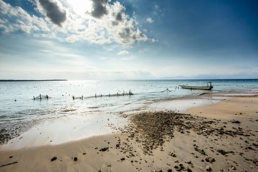 Bali, Nusa Penida Island, Toyapakeh, Indonesia - Plantations of seaweed, algae at low tide, with dramatic sky