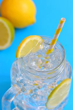 water with lemons and paper straw