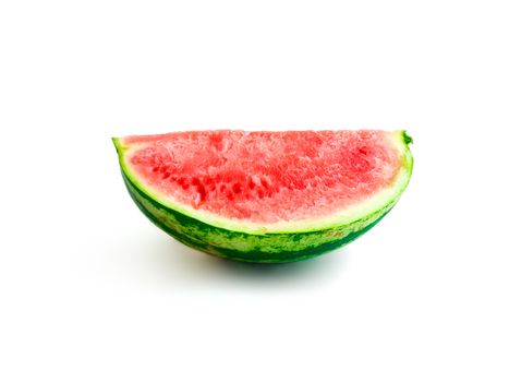 Isolated piece of watermelon without seeds on white background, quarter sideview, healthy eating, sweet summer refreshment