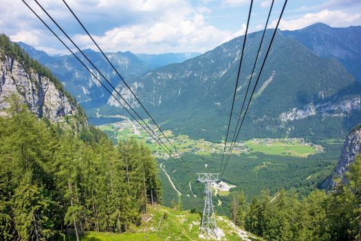 Obertraun, Austria - June 27, 2014: View of the village from the Dachstein ropeway gondola, a famous tourist destination of Salzburger Land for hikers.
