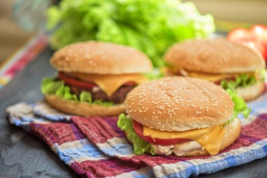 Closeup of home made burgers on wooden table