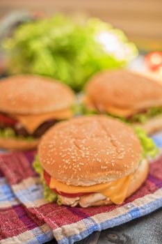 Closeup of home made burgers on wooden table