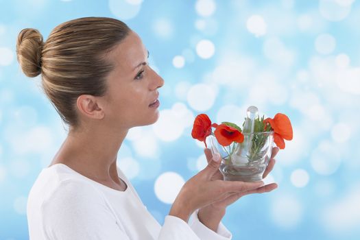 Young woman holding mortar with herbs