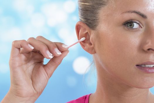 Female person using cotton stick