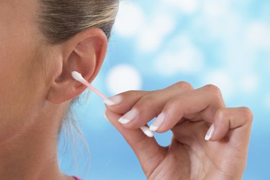 Female person using cotton stick