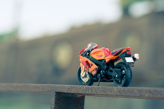 A model of a street bike resting on the gate