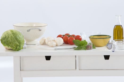 healthy foods are on the table in the kitchen on white background