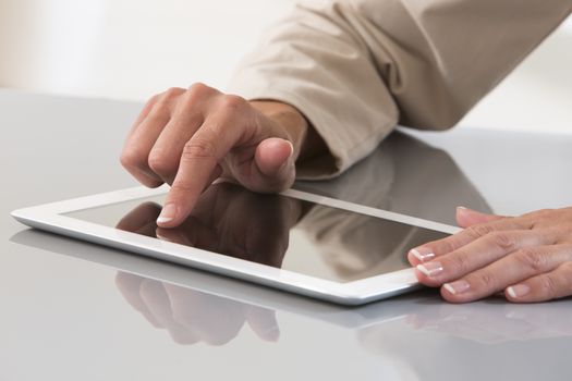 Hand of a businesswoman using a digital tablet