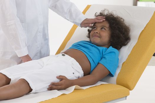 Doctor Examining Child Patient checking temperature