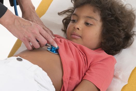 Female doctor checking little boy's pulse