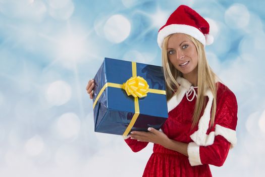 Beautiful young woman in Santa Claus clothes over with gifts