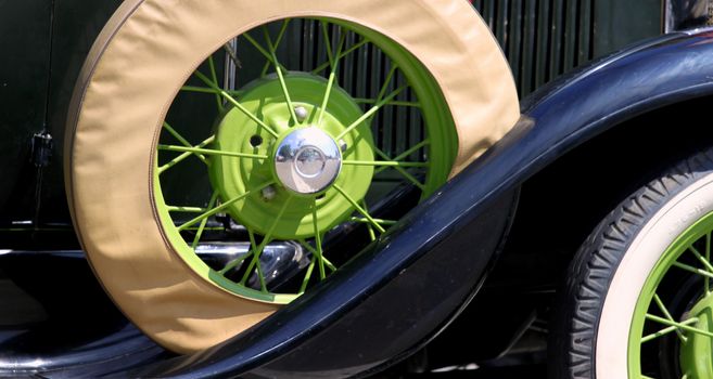 Spare tire of an very old car.