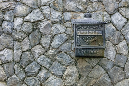 Mail box on a stone wall stone wall texture.