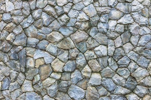 Stone wall. Texture of different forms stones similar to wall.