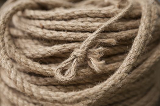 Coil of rope with marine knot loop. Roll of ship ropes as background texture