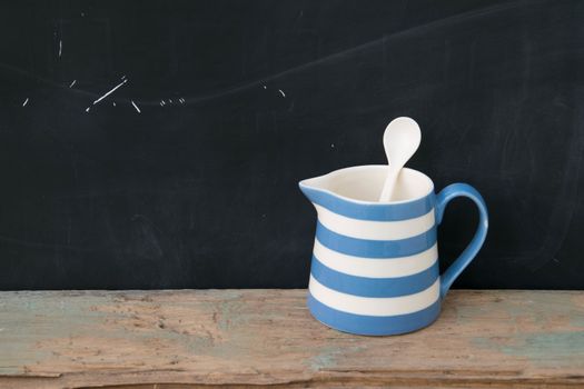 blue-white jar on wood