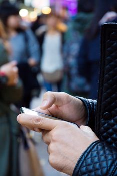 people Using a phone at a city streets