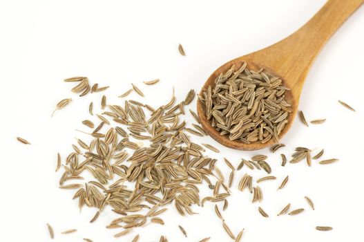 Caraway (Carum carvi) seeds close up isolated on white