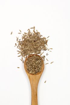 Cumin seeds close up isolated on white