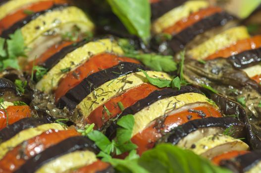 Prepared ratatouille made of white eggplants close up