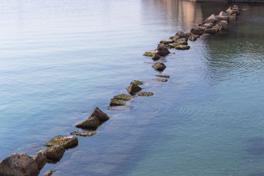 diagonal of rocks in the sea