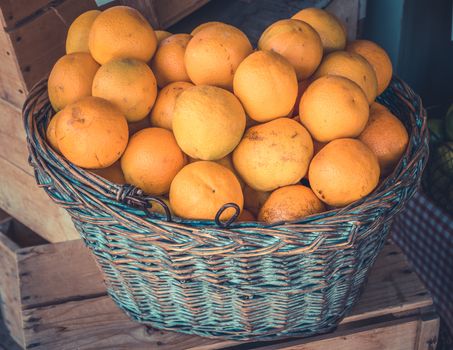 Rustic Basket Of Organic Oranges At A Health Food Store