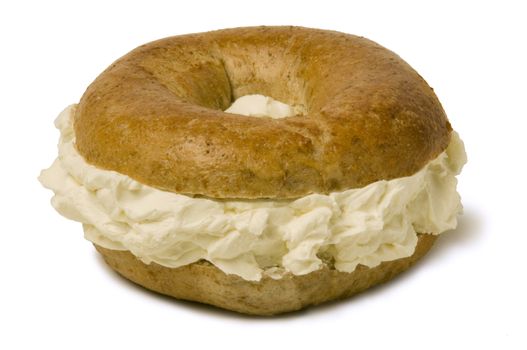 Whole wheat bagel filled with a generous amount of cream cheese