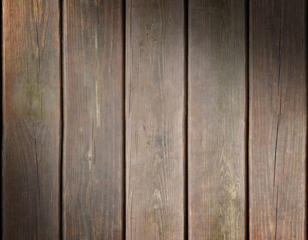 Weathered wooden plank background texture lit diagonally
