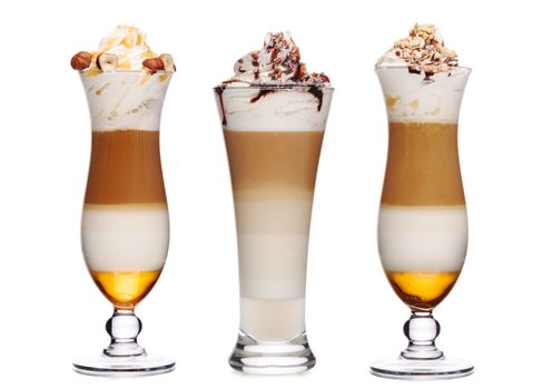 Sweet coffee cocktails with toppings decorated with various nuts