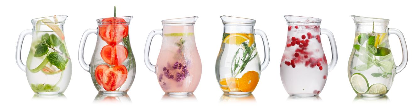 Collection of different detox water (infused water) in a glass pitchers.