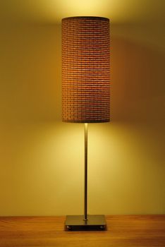 single cream lampshade on wood table