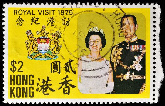 HONG KONG - CIRCA 1975: A stamp printed in the Hong Kong dedicated to the visit of Queen Elizabeth II and Prince Philip, shows a portrait of the, coat of arms of Hong Kong, circa 1975