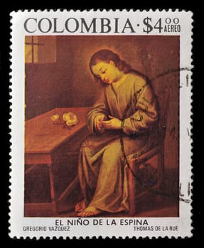 COLOMBIA - CIRCA 1976: A Stamp printed in Colombia shows a boy sitting in removing a thorn in the finger, circa 1976.