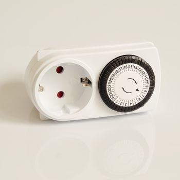 White electric timer on isolated background.