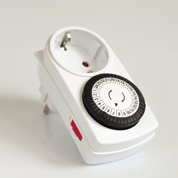 White electric timer on isolated background.