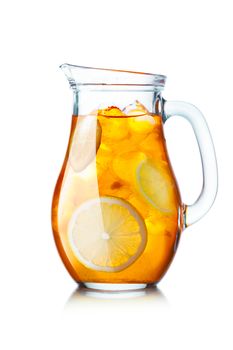 Tea with ice in a pitcher. Jug full of iced tea with lemon