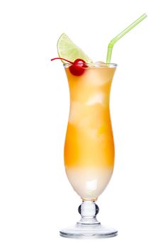 Pineapple alcoholic cocktail in hurricane glass garnished with maraschino and lime slice