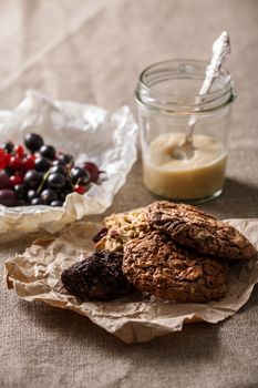 Healthy breakfast. Chocolate chip and oatmeal cookies, yogurt and fresh currant berries