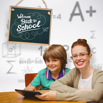 Happy pupil and teacher against grey background